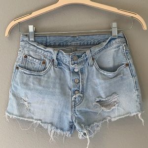 Levi 501 distressed blue Jean shorts. Size 26.